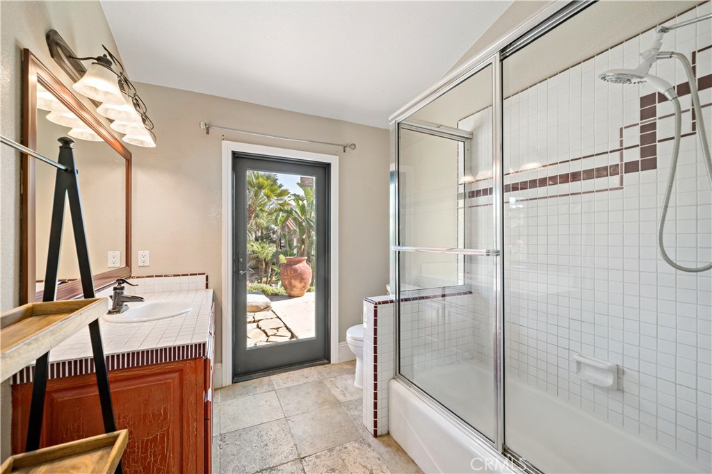 40430 Parado Del Sol Drive Temecula, CA 92592 - Photo 37 of 75 a bathroom with a shower and a sink