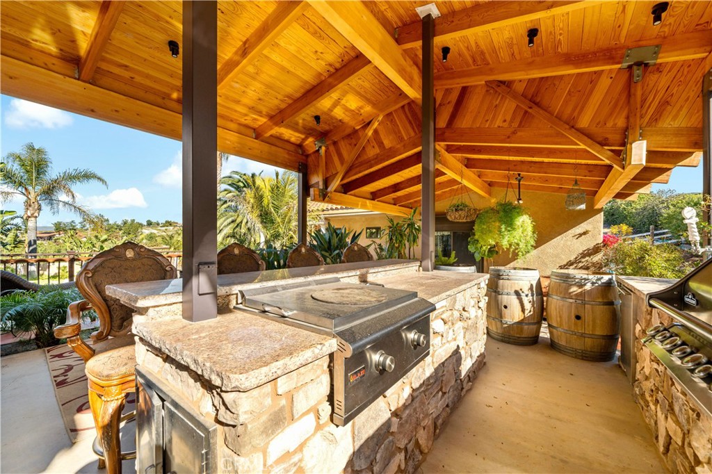 40430 Parado Del Sol Drive Temecula, CA 92592 - Photo 51 of 75 a view of a patio with a table and chairs