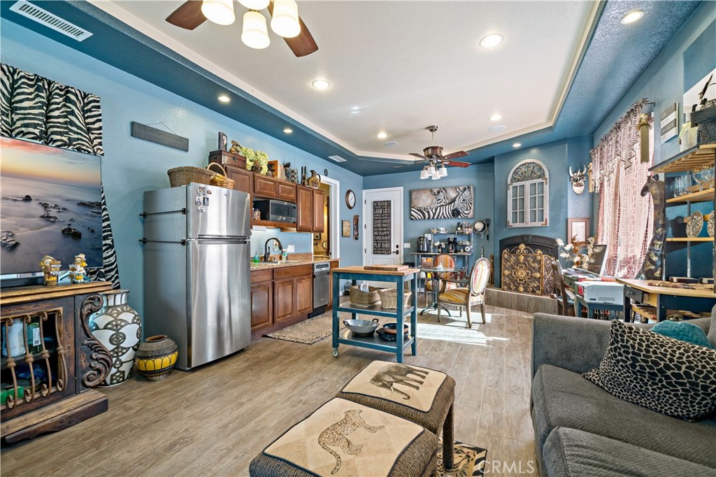 40430 Parado Del Sol Drive Temecula, CA 92592 - Photo 68 of 75 a living room with furniture kitchen view and a refrigerator