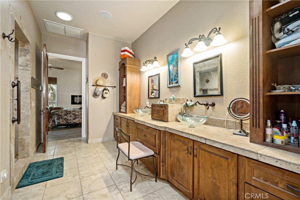 40430 Parado Del Sol Drive Temecula, CA 92592 - Photo 72 of 75 a spacious bathroom with a sink double vanity and a mirror