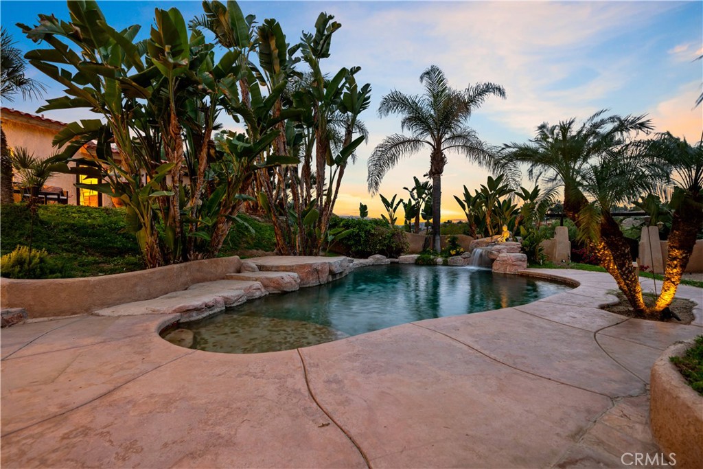 40430 Parado Del Sol Drive Temecula, CA 92592 - Photo 10 of 75 a view of a swimming pool with a table and chair