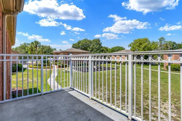 a view of a big room with refrigerator and a kitchen
