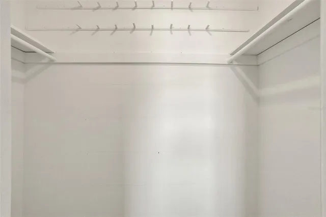 an aerial view of a house with swimming pool and outdoor seating