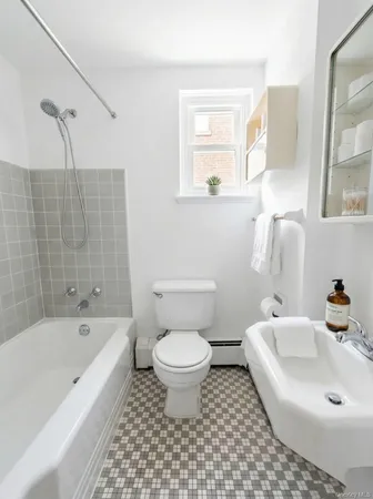 a bathroom with a sink toilet and bathtub