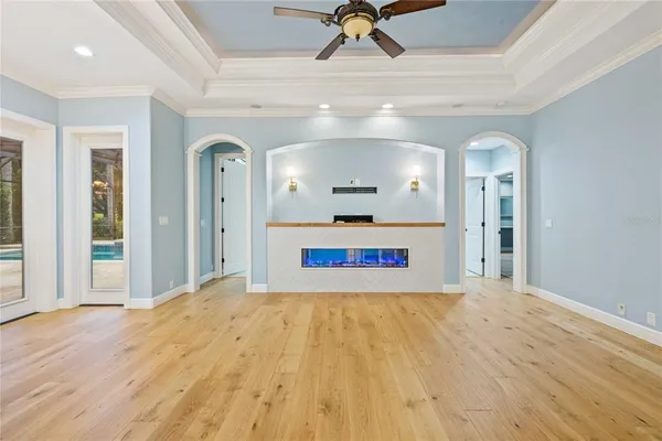 a spacious bedroom with a large bed and a window