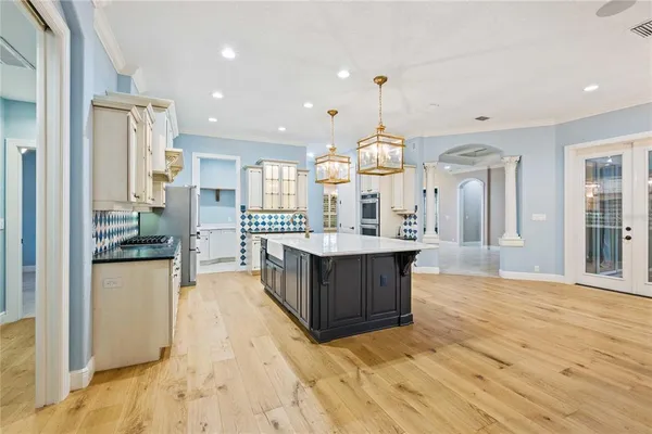 a bathroom with double vanity sinks and a mirror