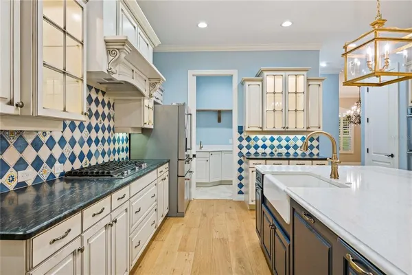 a bathroom with a granite countertop toilet and a sink