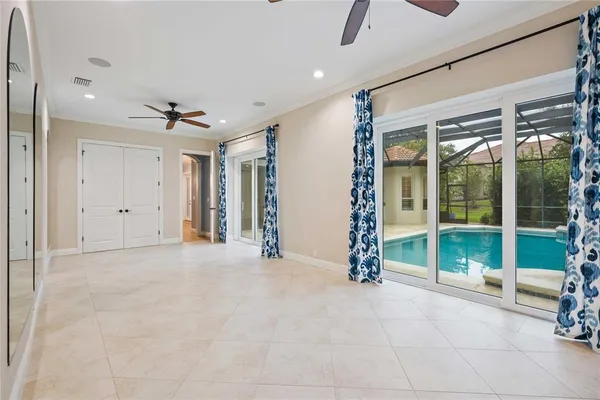 a view of a house with pool fire pit and furniture