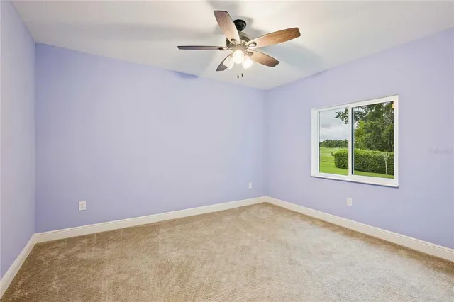 a view of a house with pool fire pit and furniture