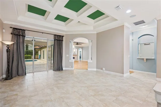 a large kitchen with stainless steel appliances kitchen island a large counter top and wooden floors