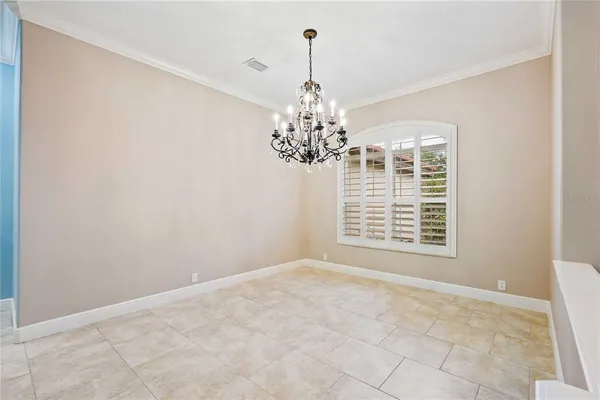 a large kitchen with stainless steel appliances kitchen island a large counter top and wooden floors