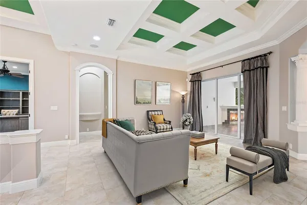 an empty room with ceiling fan and window