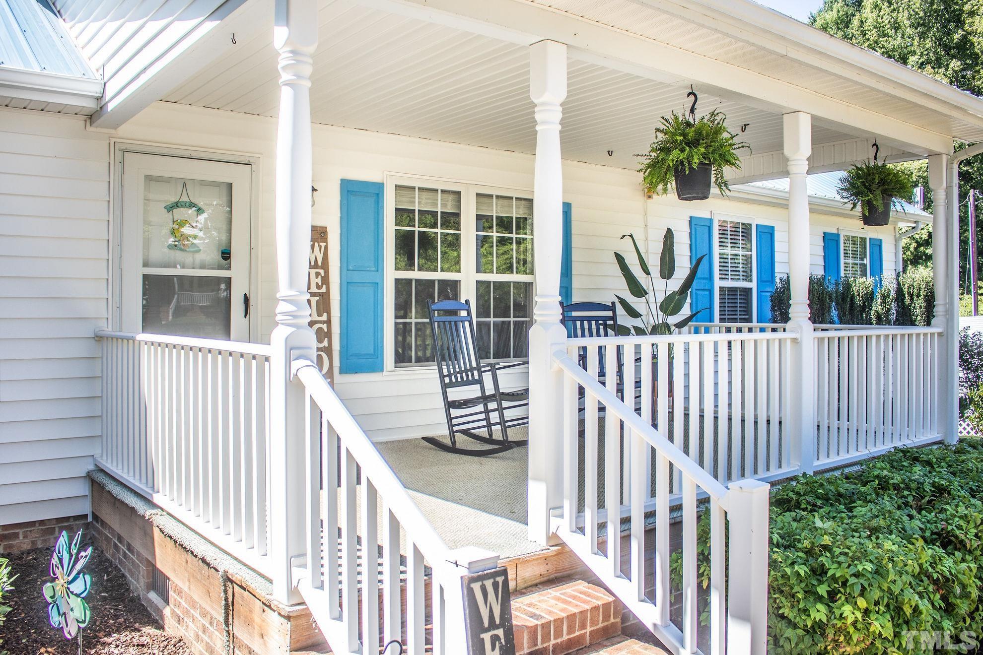 260 Waters Edge Loop Henderson, NC 27537 - Photo 1 of 38 a view of a house with a small yard and wooden floor and fence