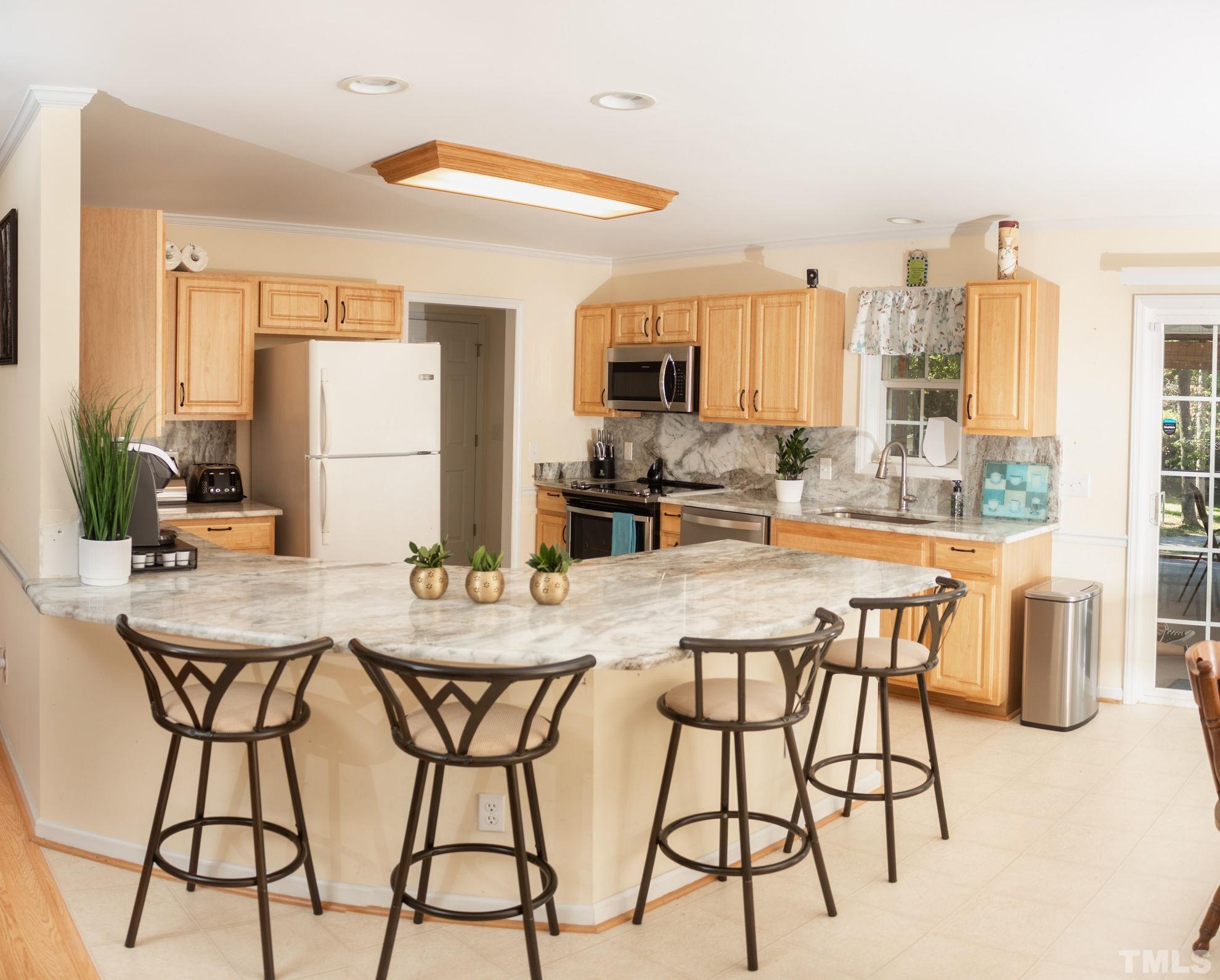 260 Waters Edge Loop Henderson, NC 27537 - Photo 14 of 38 a view of a dining room with furniture window and outside view
