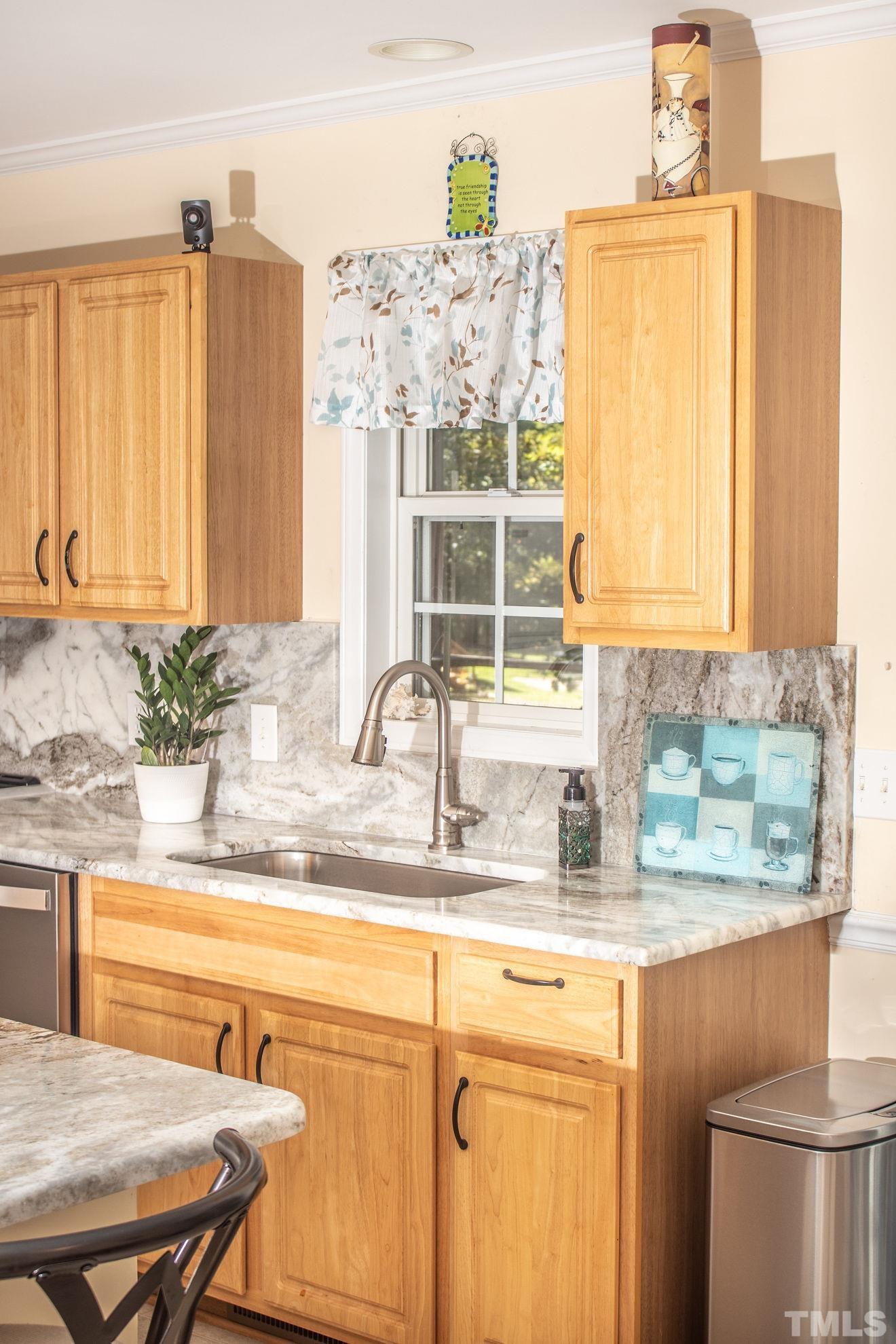 260 Waters Edge Loop Henderson, NC 27537 - Photo 17 of 38 a kitchen with a sink and a window