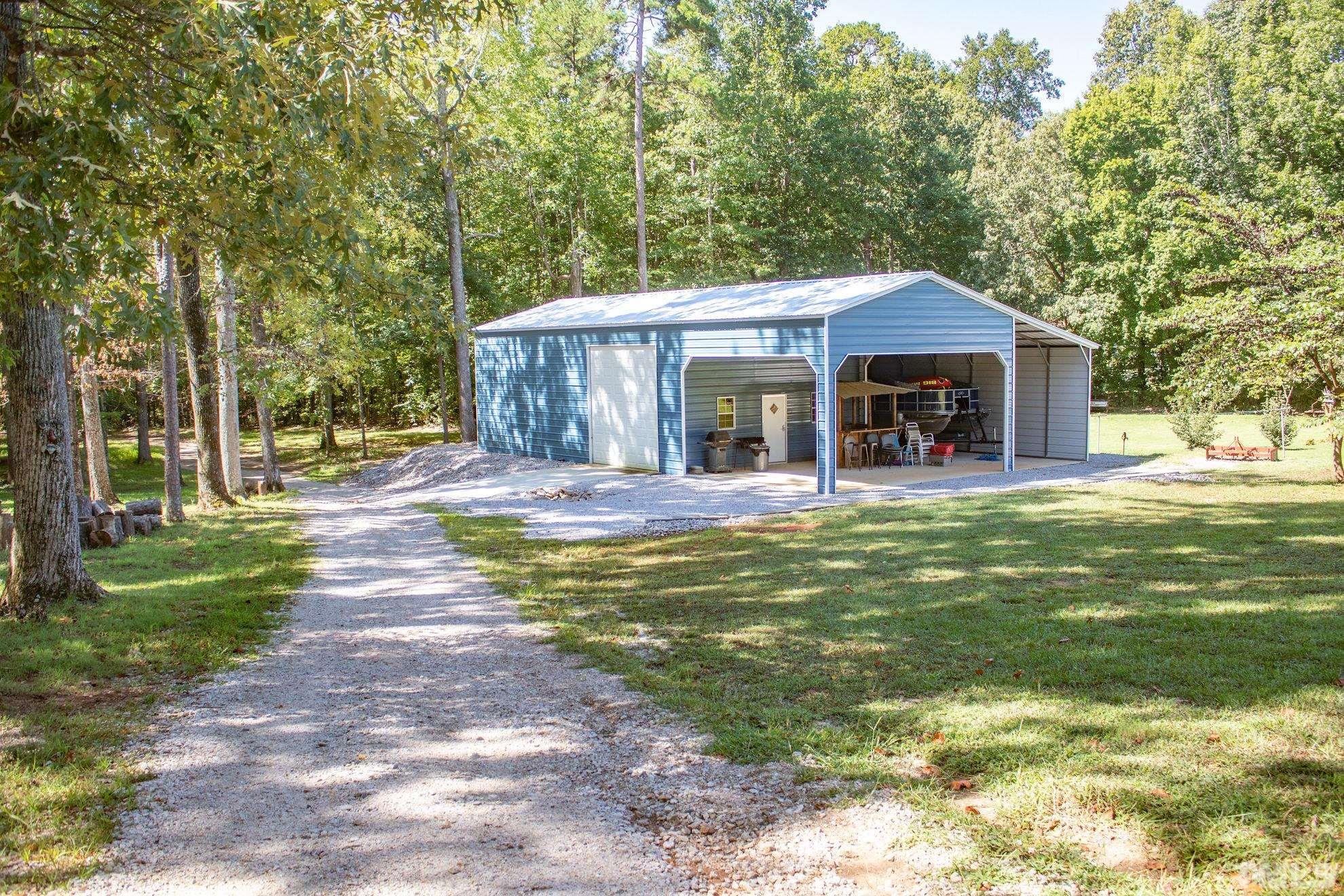 260 Waters Edge Loop Henderson, NC 27537 - Photo 30 of 38 a view of a house with a yard balcony and tree s