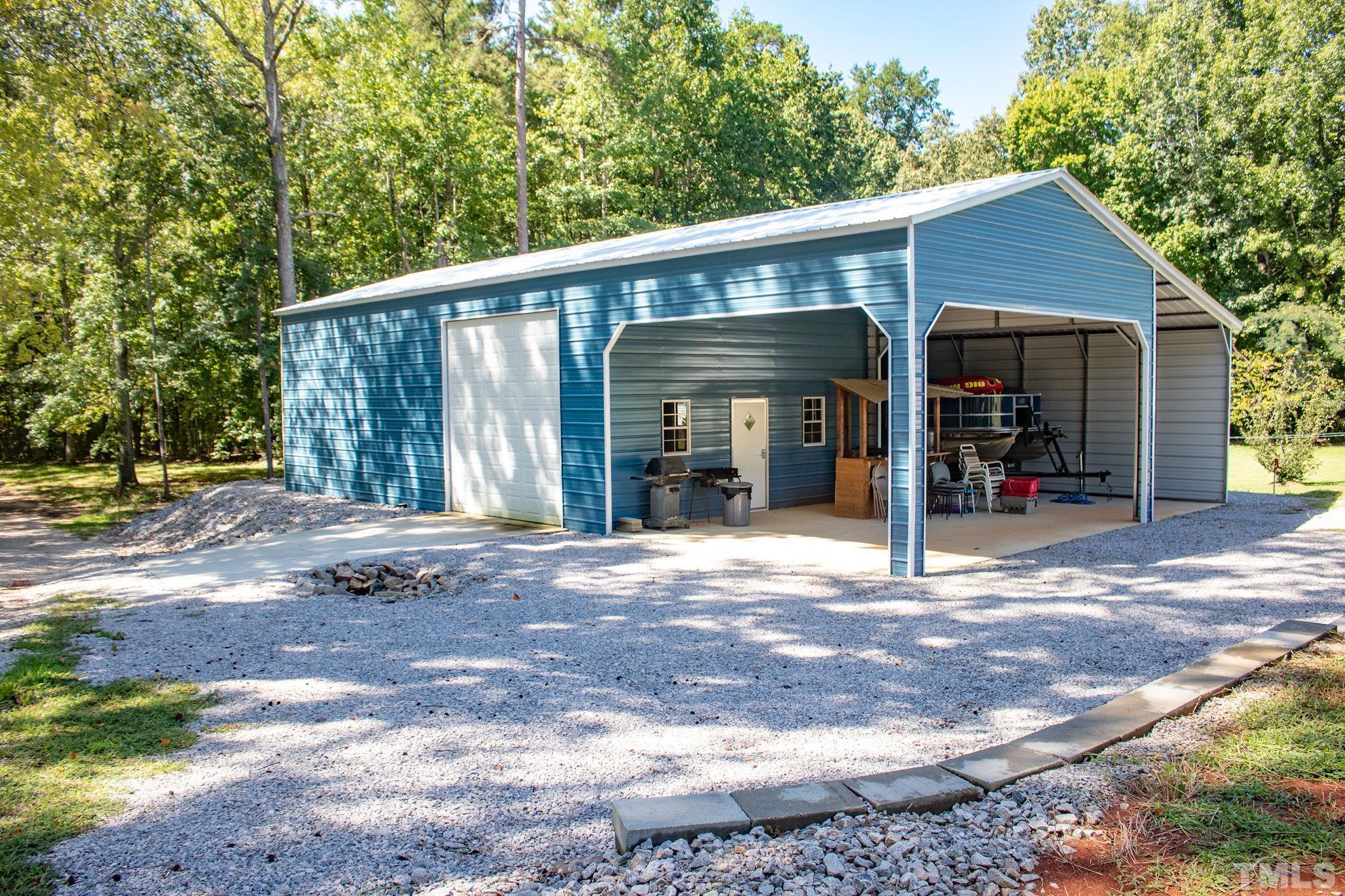 260 Waters Edge Loop Henderson, NC 27537 - Photo 3 of 38 a front view of a house with a porch
