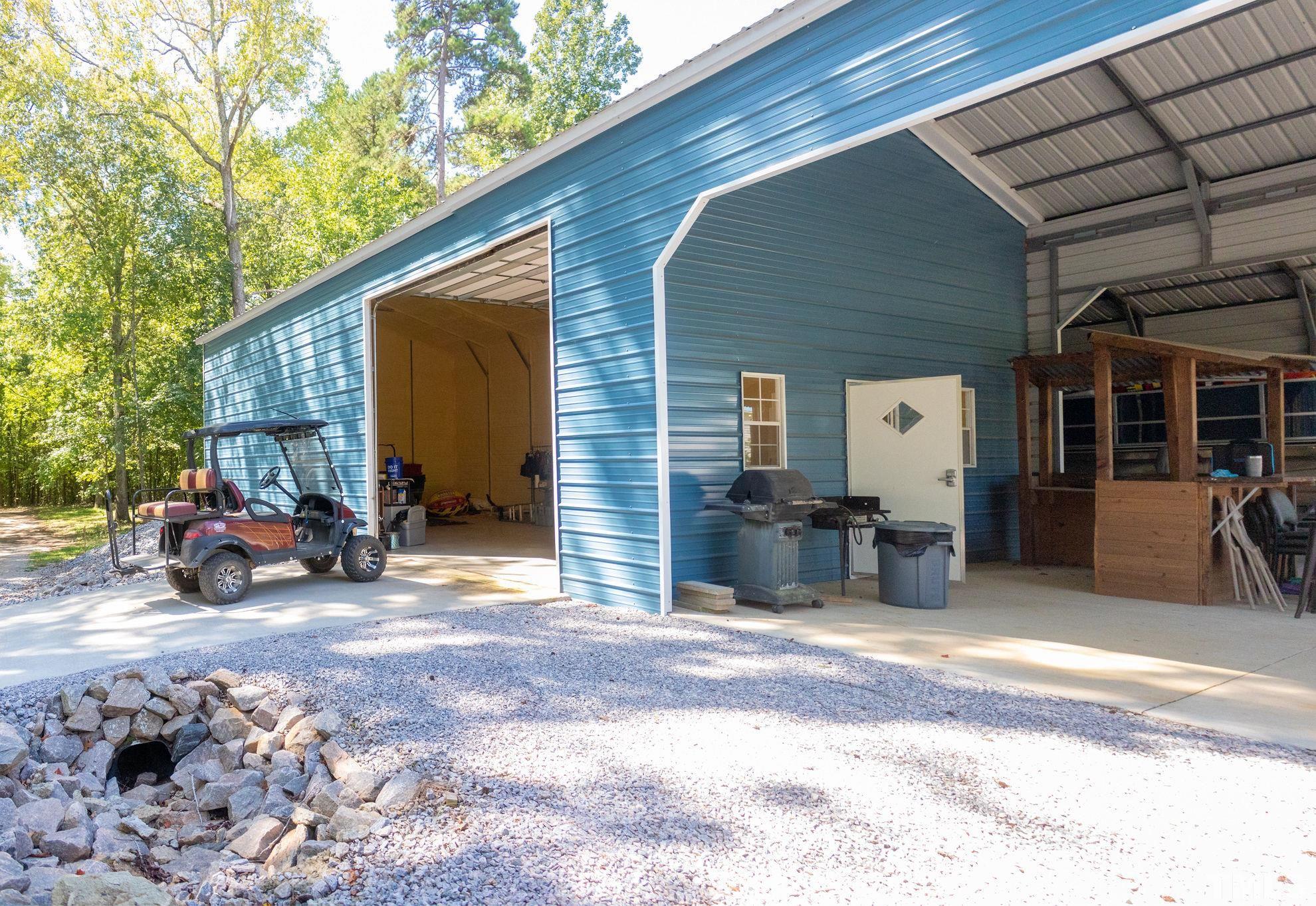 260 Waters Edge Loop Henderson, NC 27537 - Photo 32 of 38 a view of a car in front of house