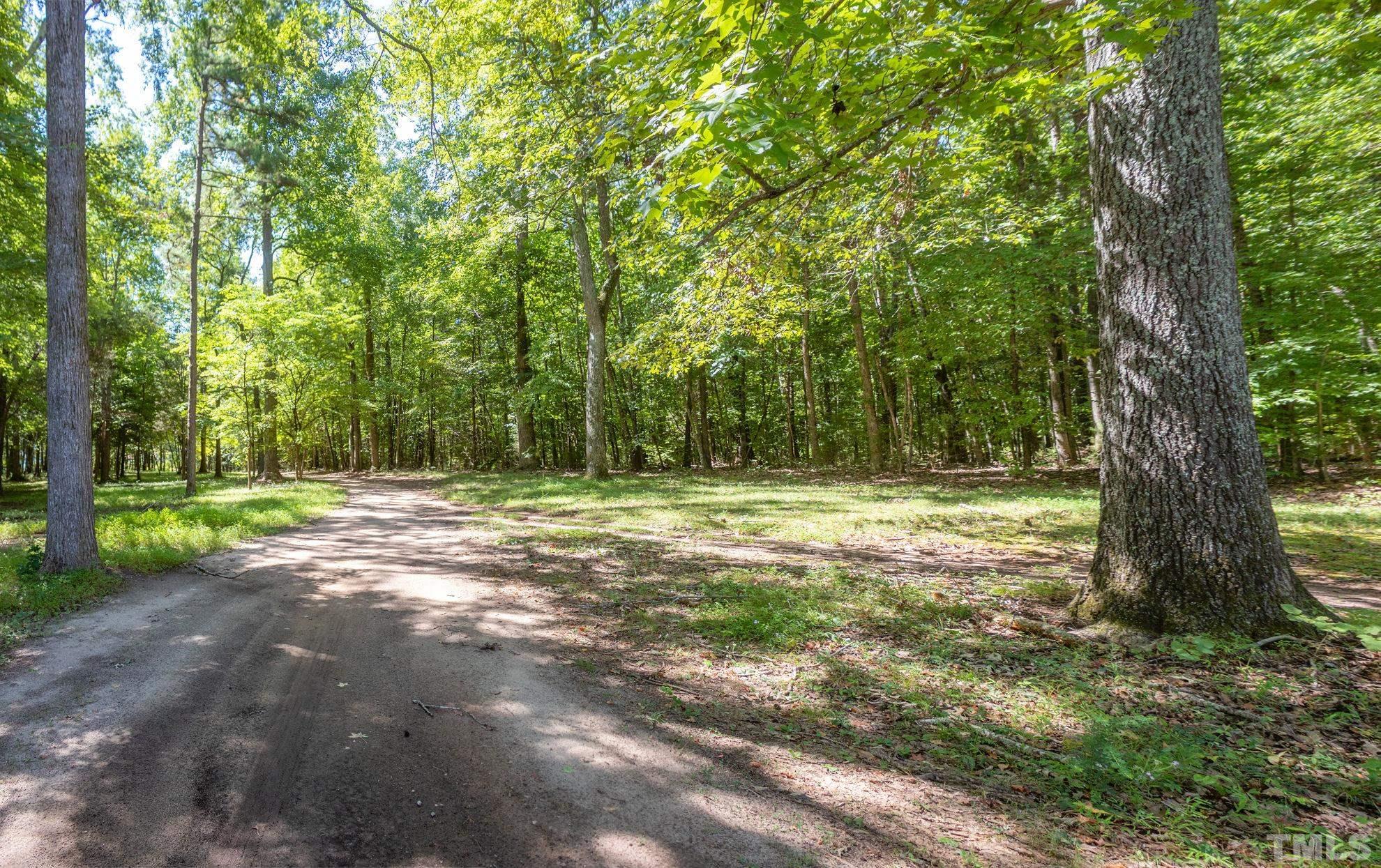 260 Waters Edge Loop Henderson, NC 27537 - Photo 35 of 38 a view of outdoor space with deck and tree