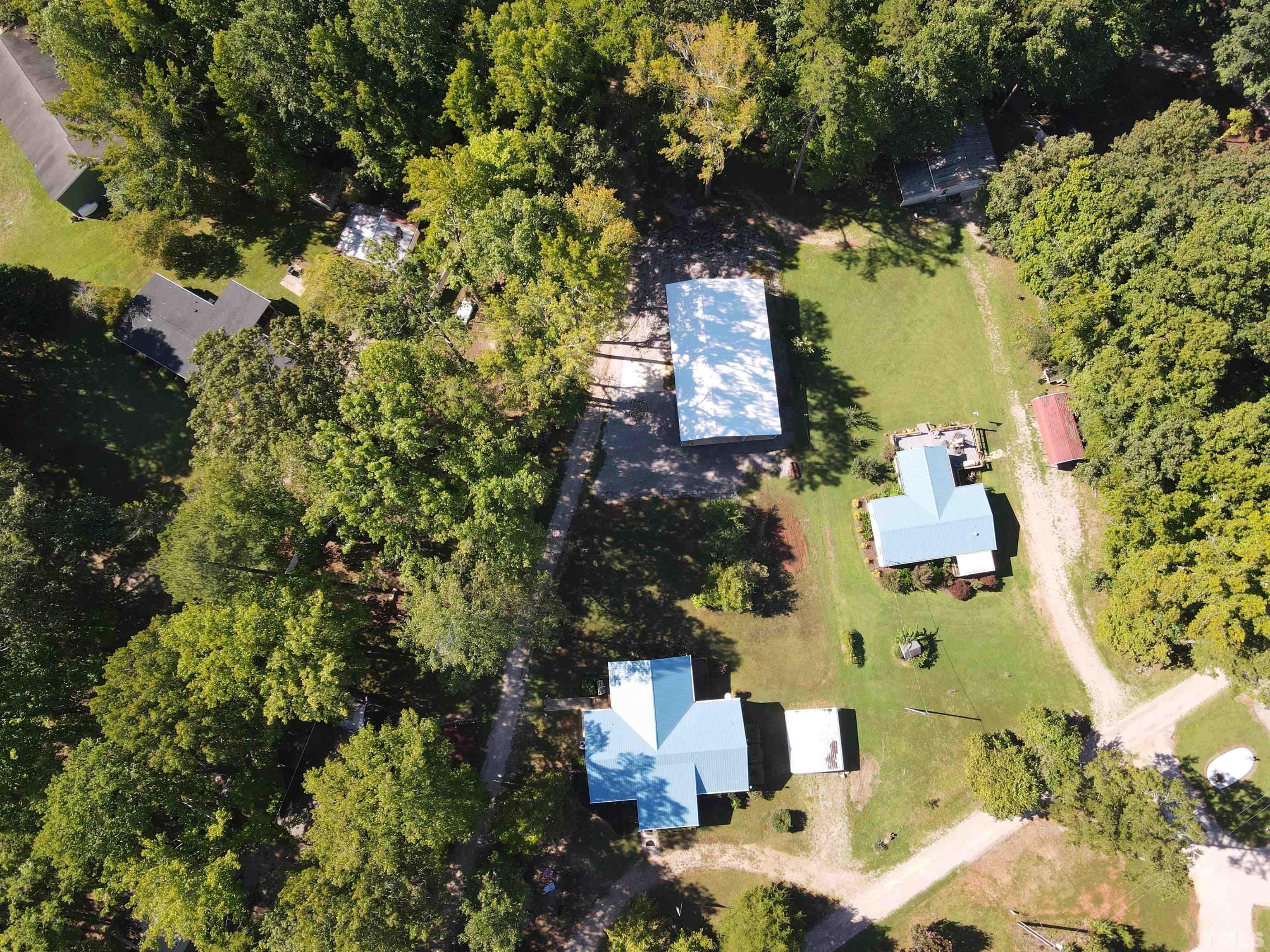 260 Waters Edge Loop Henderson, NC 27537 - Photo 4 of 38 an aerial view of residential houses with outdoor space