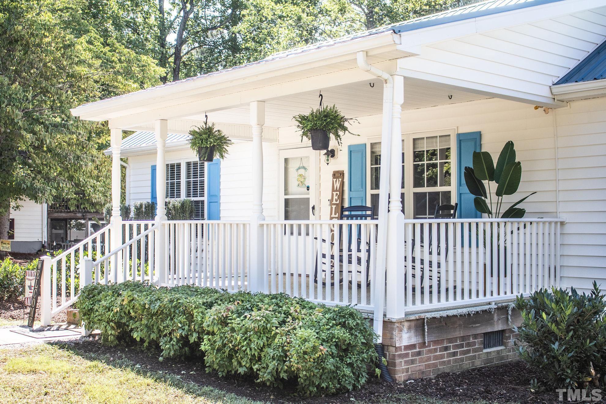 260 Waters Edge Loop Henderson, NC 27537 - Photo 7 of 38 a view of a house with a small yard and wooden fence