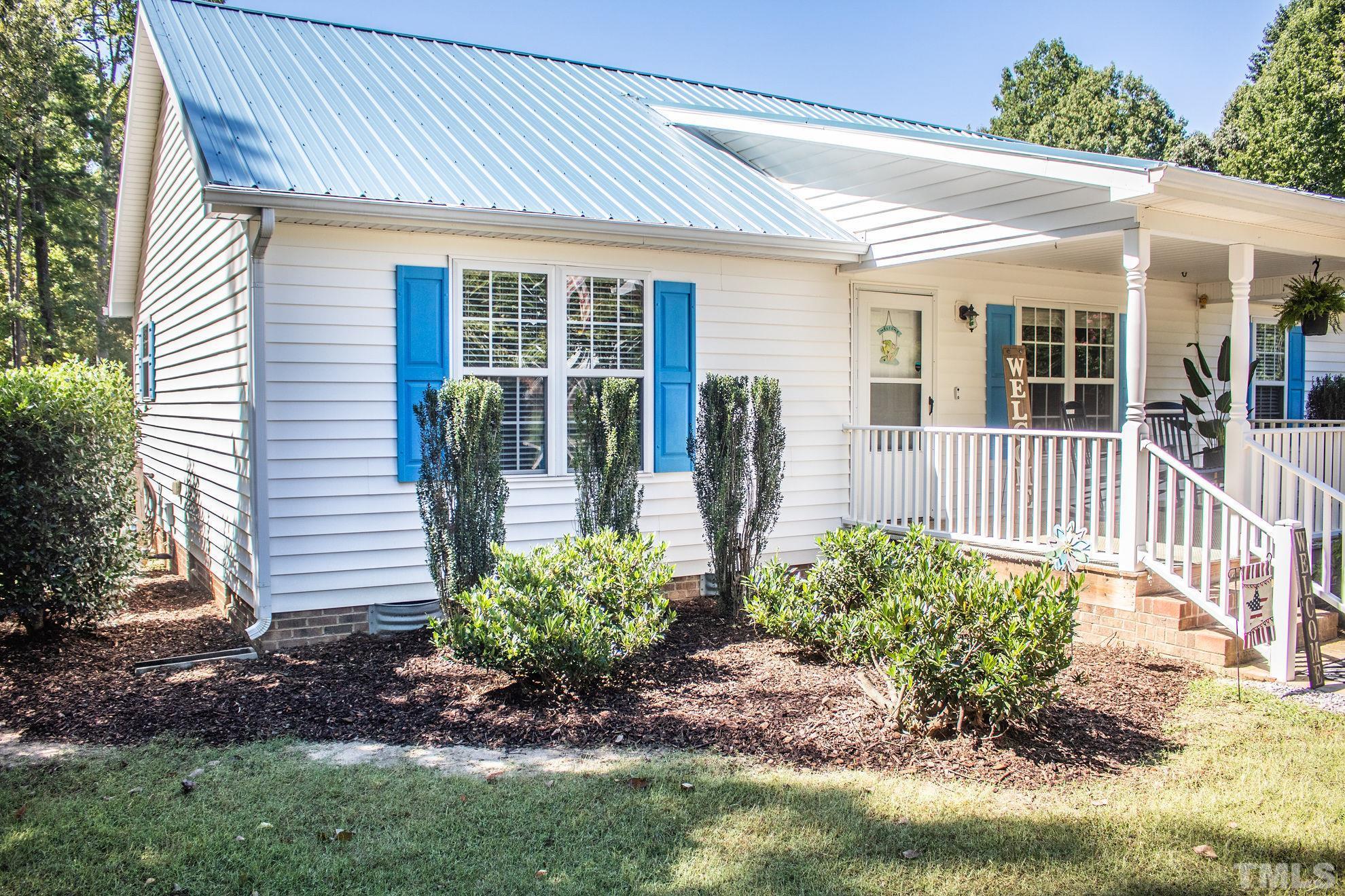 260 Waters Edge Loop Henderson, NC 27537 - Photo 8 of 38 front view of a house with a yard