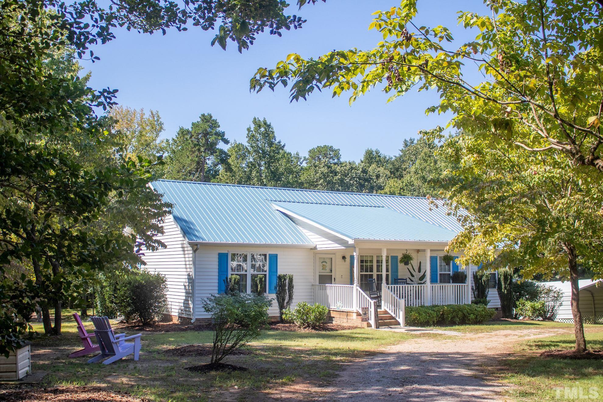 260 Waters Edge Loop Henderson, NC 27537 - Photo 9 of 38 a front view of a house with a yard
