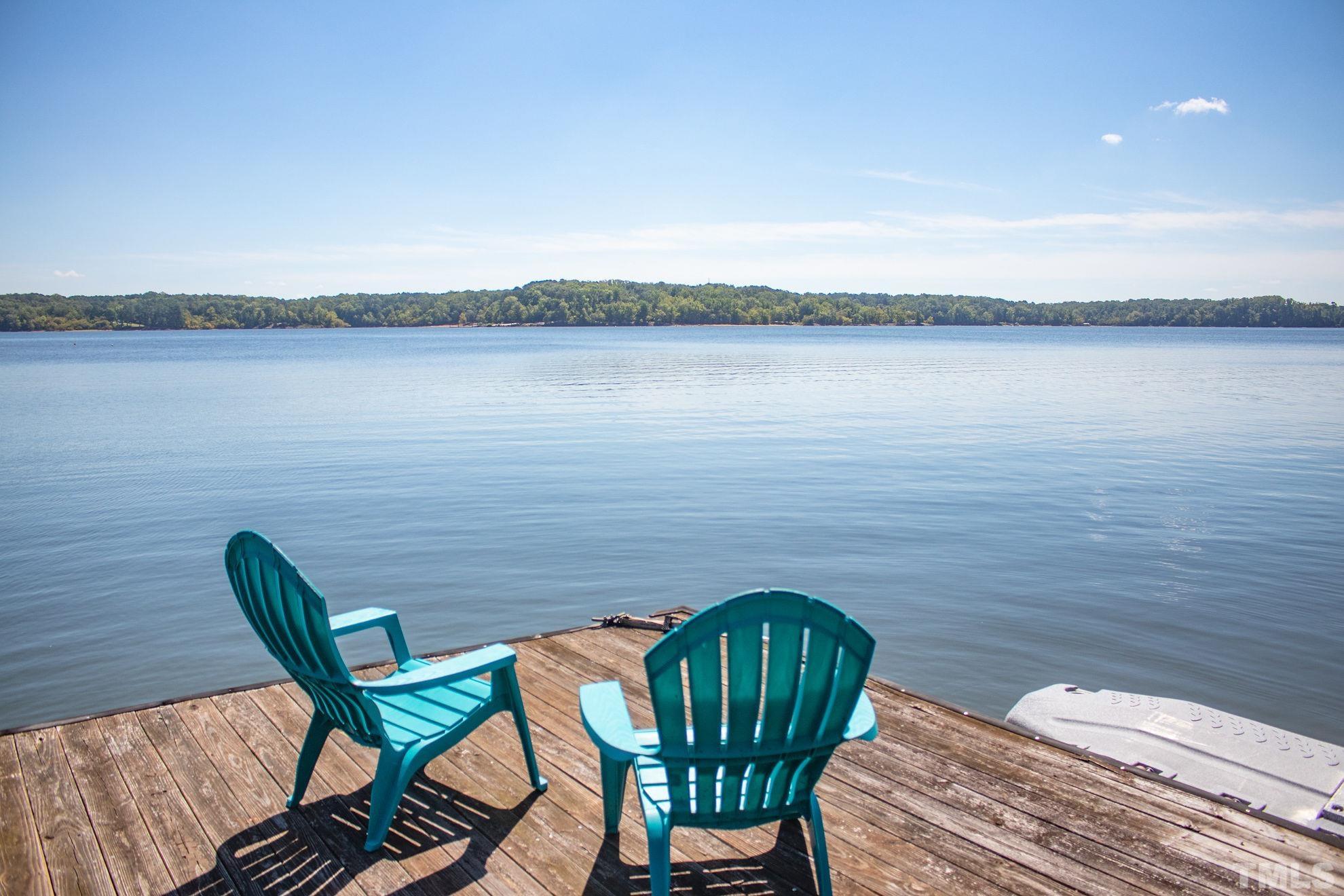 260 Waters Edge Loop Henderson, NC 27537 - Photo 10 of 38 a view of a chairs and table in wooden floor