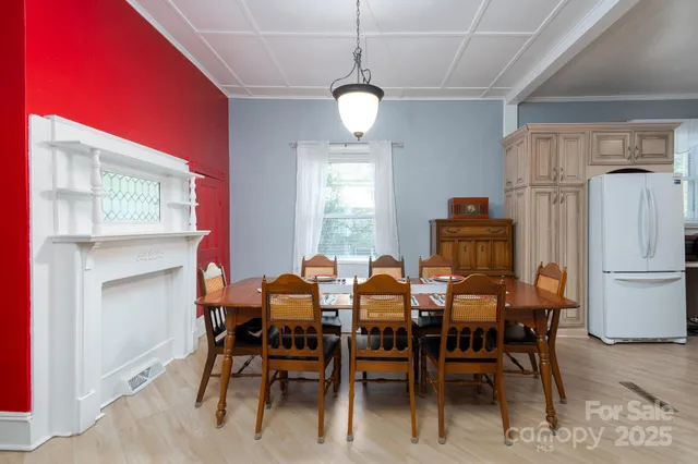 a dining room with furniture and window