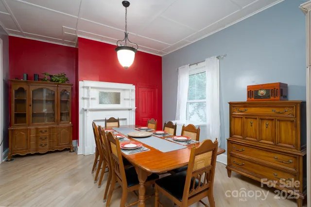 a kitchen with refrigerator cabinets dining table and chairs