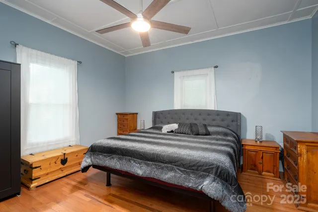 a bedroom with a bed and a fireplace