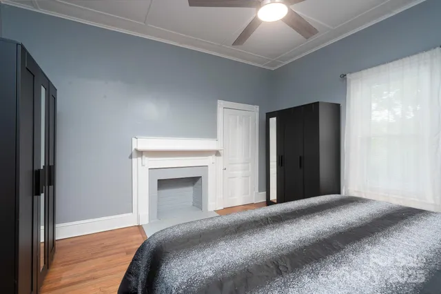 a bedroom with furniture and a window