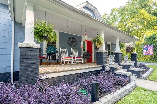 a front view of a house with garden