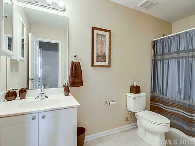 10628 Pointer Ridge Drive Charlotte, NC 28214 - Photo 15 of 16 a bathroom with a sink and a mirror