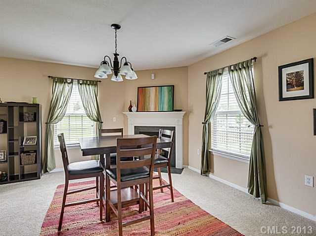 10628 Pointer Ridge Drive Charlotte, NC 28214 - Photo 5 of 16 a dining room with furniture window and wooden floor