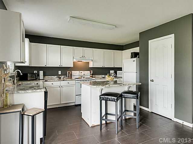 10628 Pointer Ridge Drive Charlotte, NC 28214 - Photo 8 of 16 a kitchen with appliances cabinets and a sink