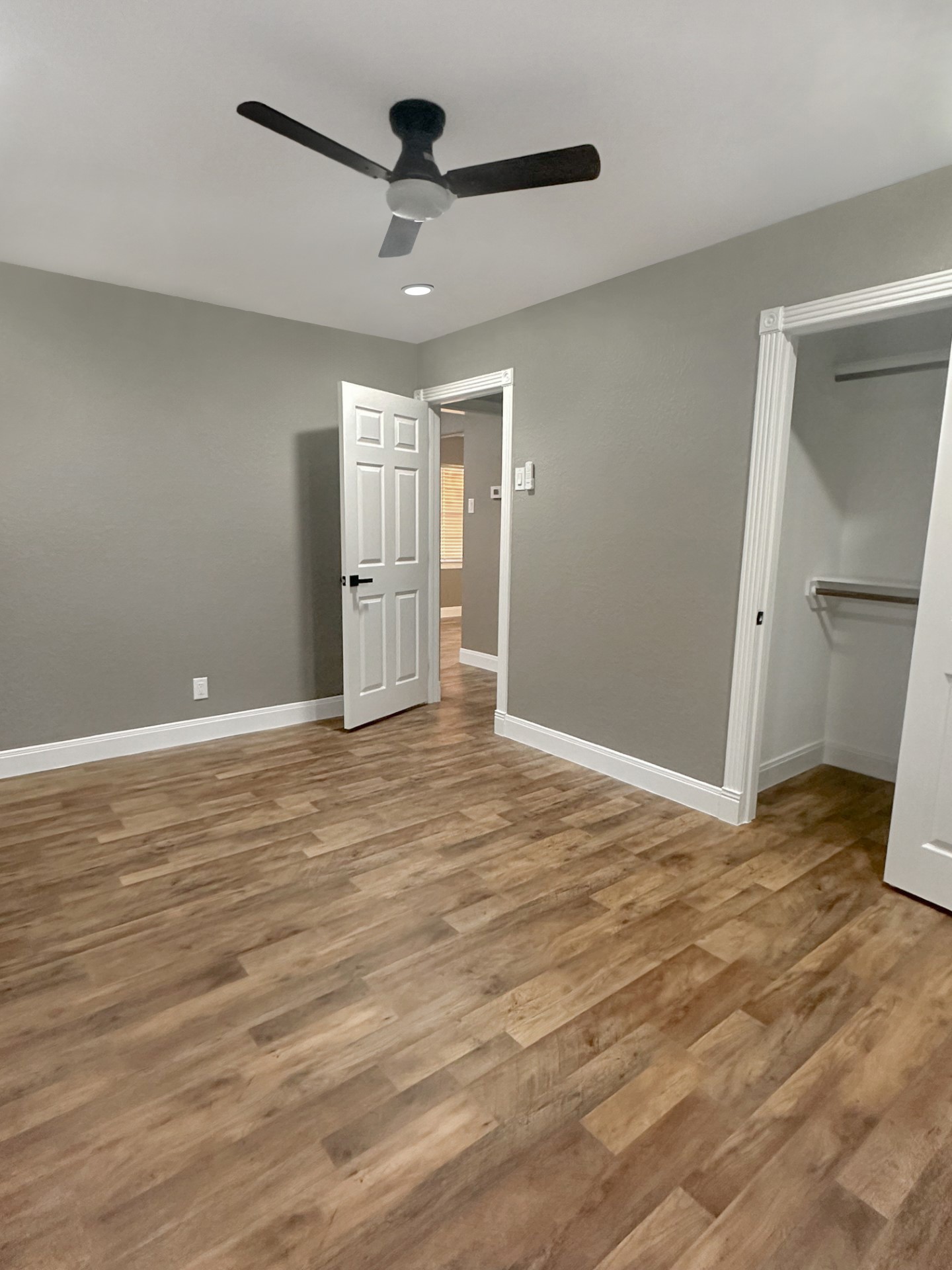 1308 North Rockisland Street Angleton, TX 77515 - Photo 11 of 13 a view of an empty room and wooden floor