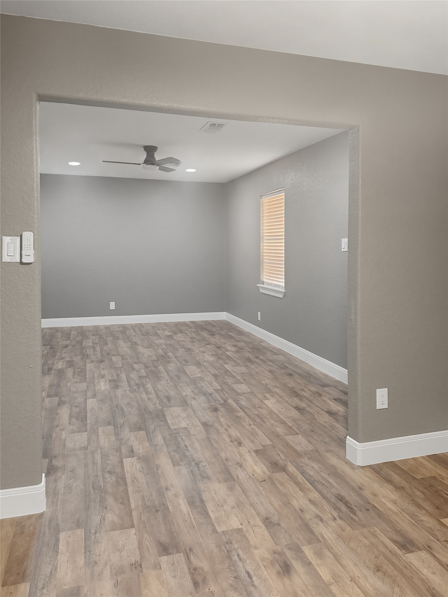 1308 North Rockisland Street Angleton, TX 77515 - Photo 5 of 13 a view of an empty room with a window