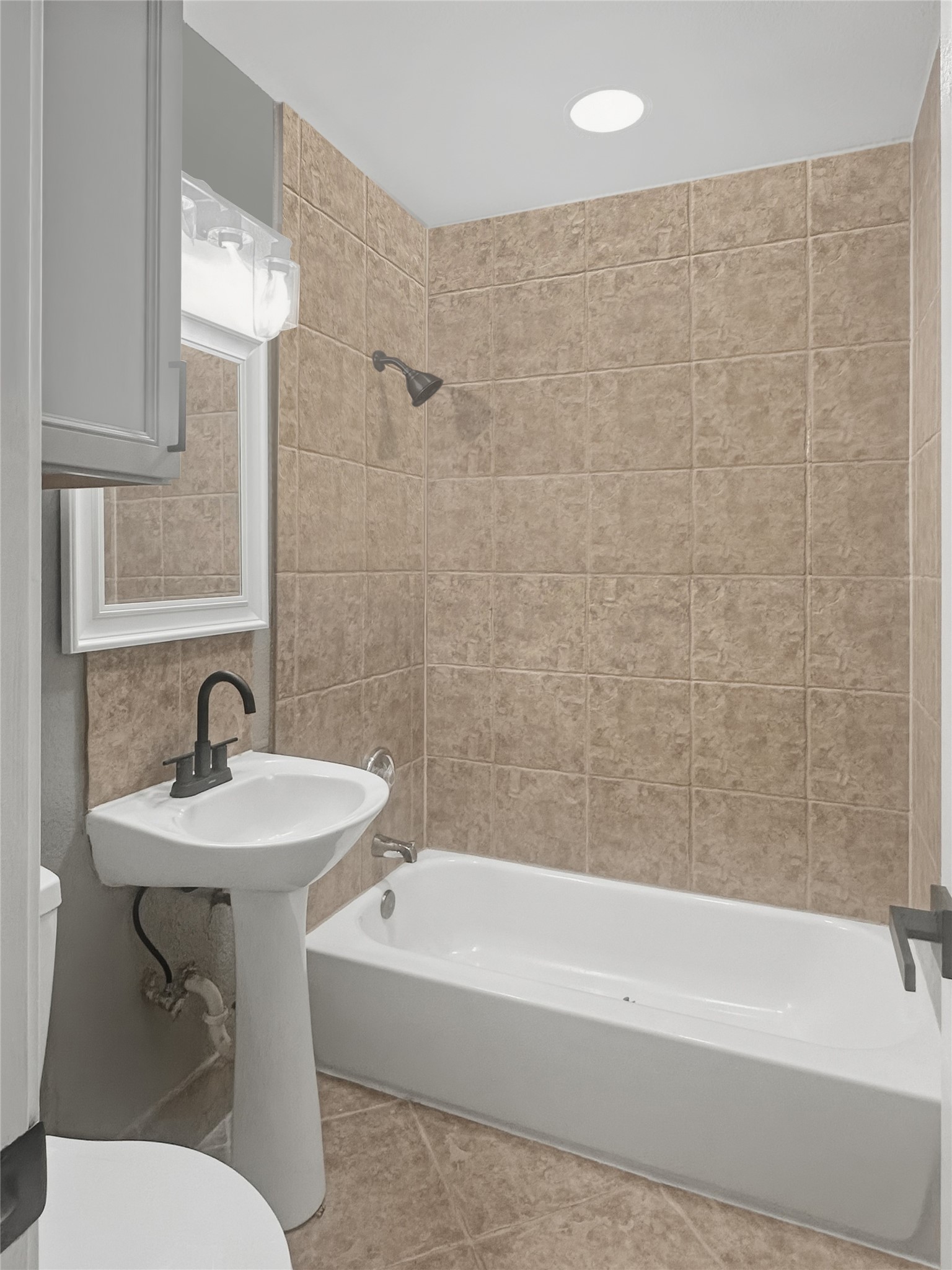 1308 North Rockisland Street Angleton, TX 77515 - Photo 10 of 13 a bathroom with a sink a toilet and bathtub