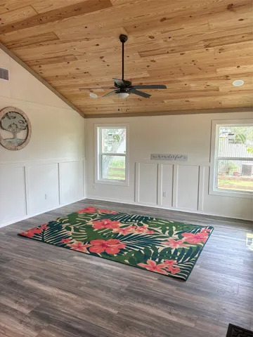 a view of a room with an empty space and window