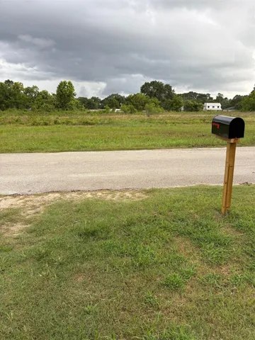 a view of a field with an ocean
