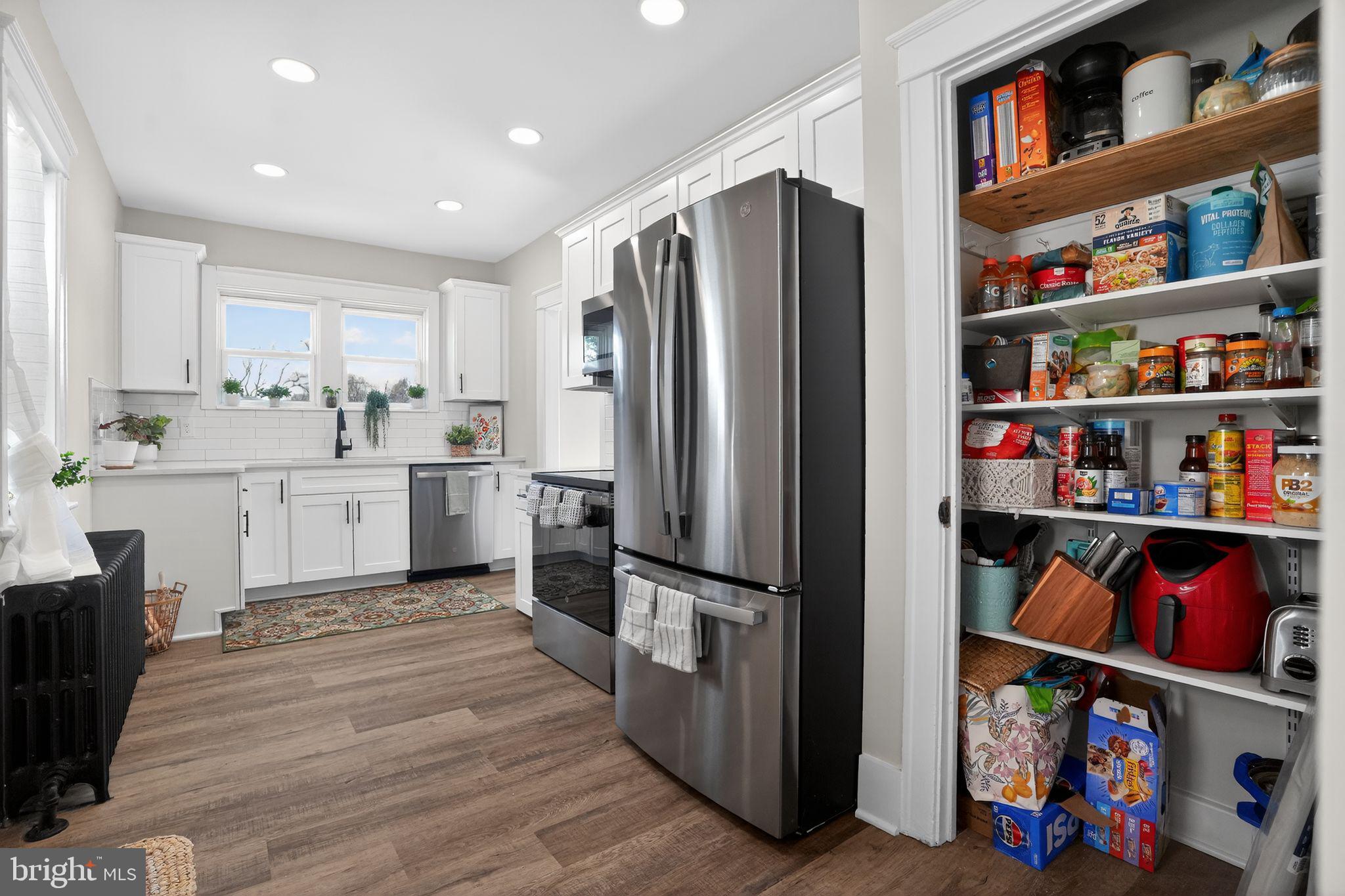 424 Arch Street Spring City, PA 19475 - Photo 17 of 32 a kitchen with stainless steel appliances granite countertop a refrigerator and a sink