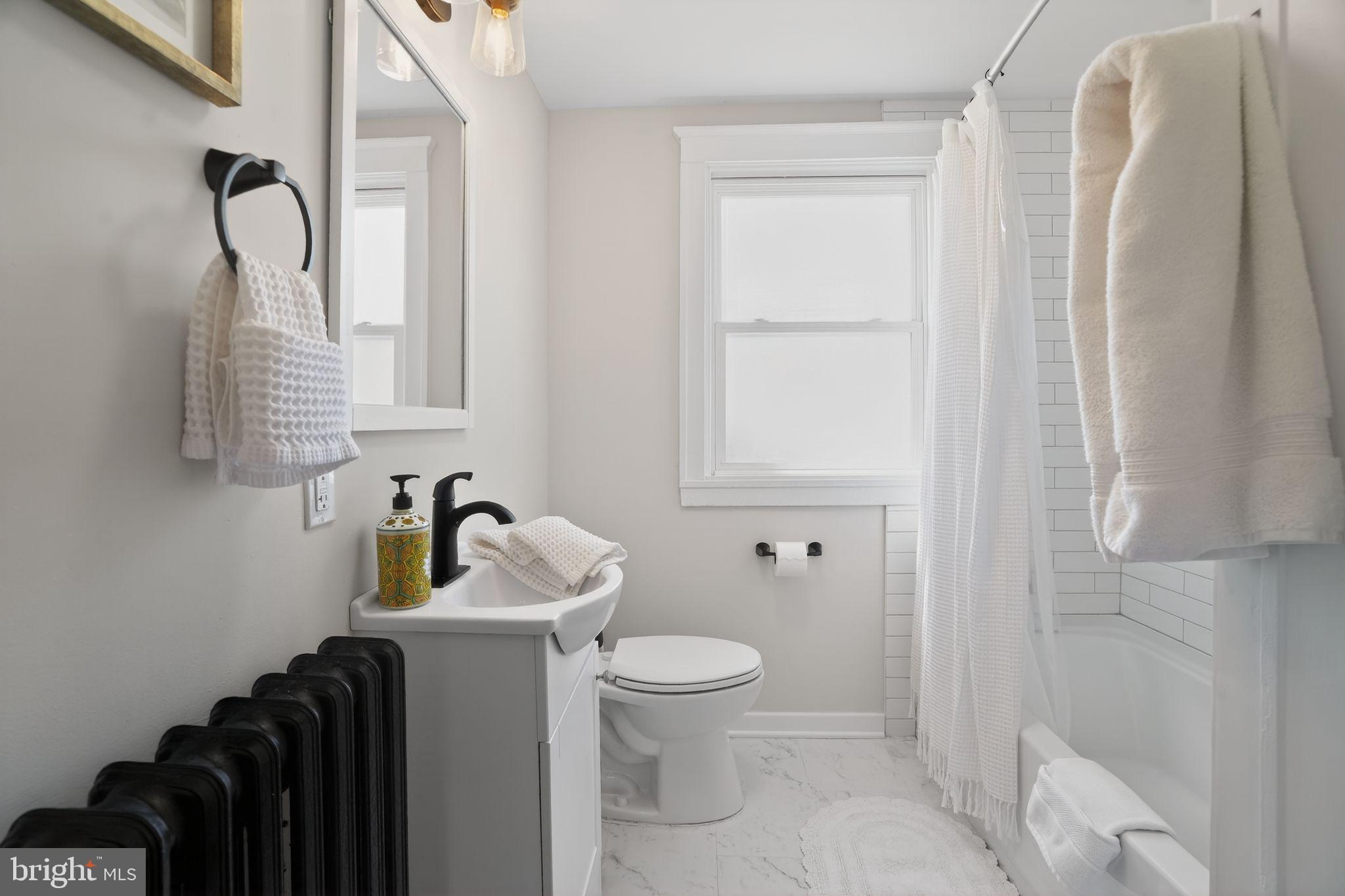 424 Arch Street Spring City, PA 19475 - Photo 27 of 32 a bathroom with a toilet sink and shower