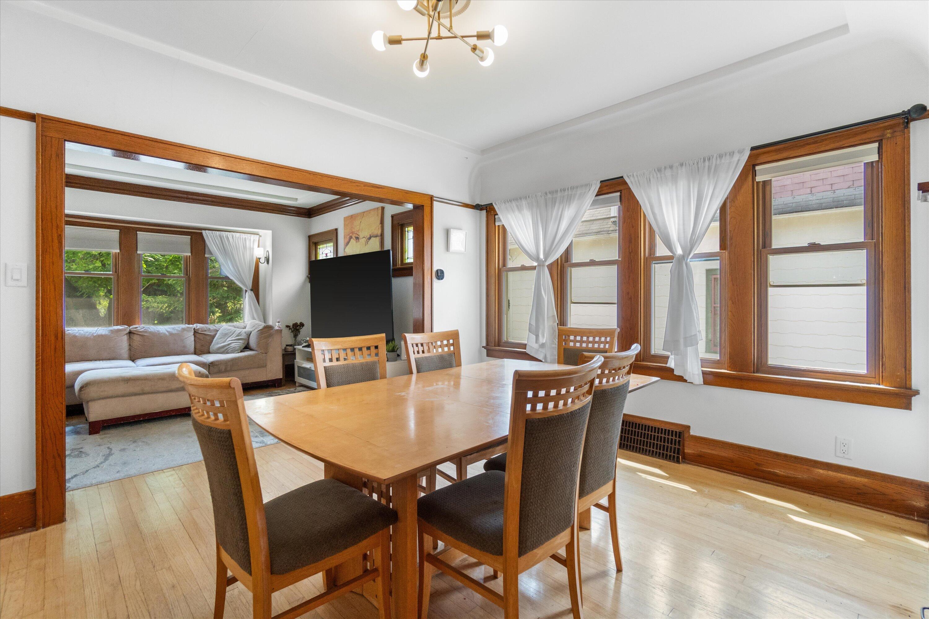 159 North 59th Street Milwaukee, WI 53213 - Photo 26 of 34 Bright dining room with hardwood floors and large windows overlooking the front of the home