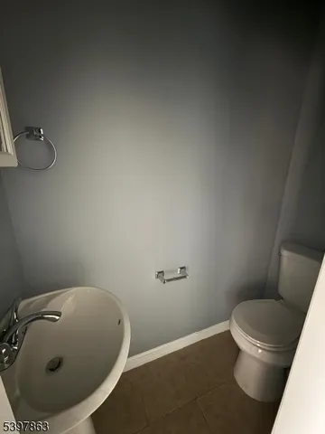a bathroom with a toilet and a sink