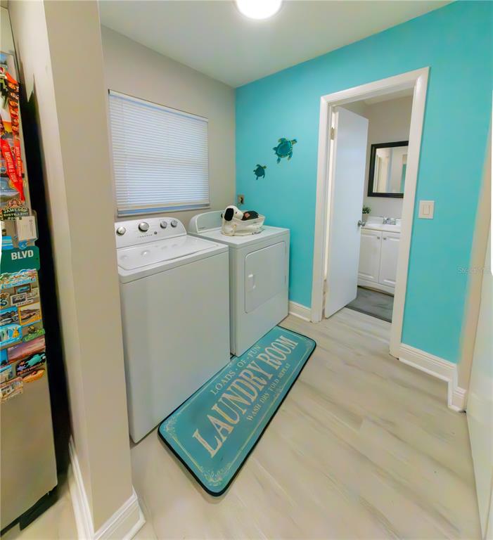 6414 Indiana Avenue New Port Richey, FL 34653 - Photo 13 of 31 a utility room with dryer and washer