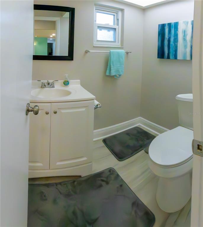 6414 Indiana Avenue New Port Richey, FL 34653 - Photo 18 of 31 a bathroom with a sink and a mirror