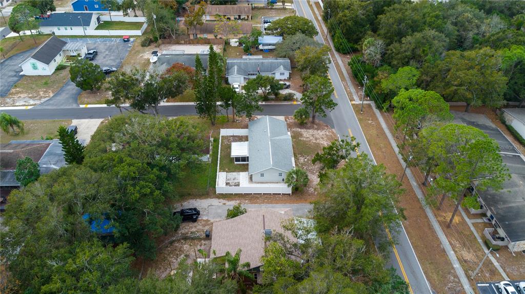 6414 Indiana Avenue New Port Richey, FL 34653 - Photo 29 of 31 an aerial view of a house with a garden