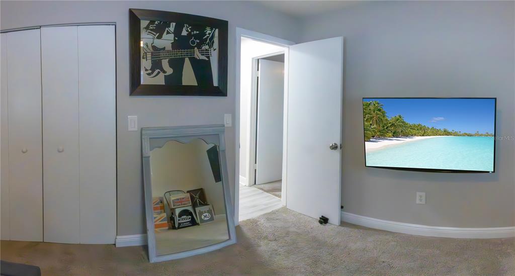 6414 Indiana Avenue New Port Richey, FL 34653 - Photo 9 of 31 a view of a hallway with paintings on the wall