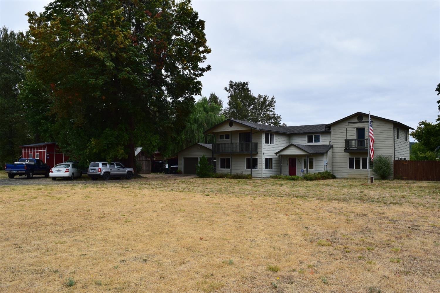 847 Big Bend Road Roseburg, OR 97471 - Photo 2 of 25 a house with trees in the background